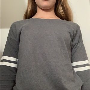 Woman’s grey long sleeve shirt.